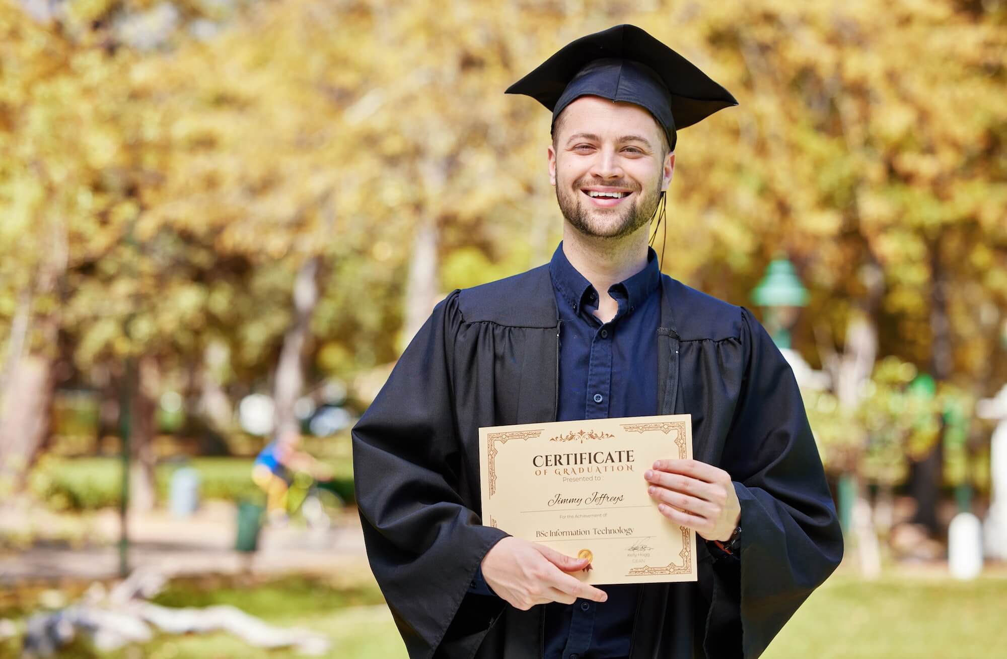 Graduate, guy and certificate with portrait in outdoor with success for education or scholarship. A